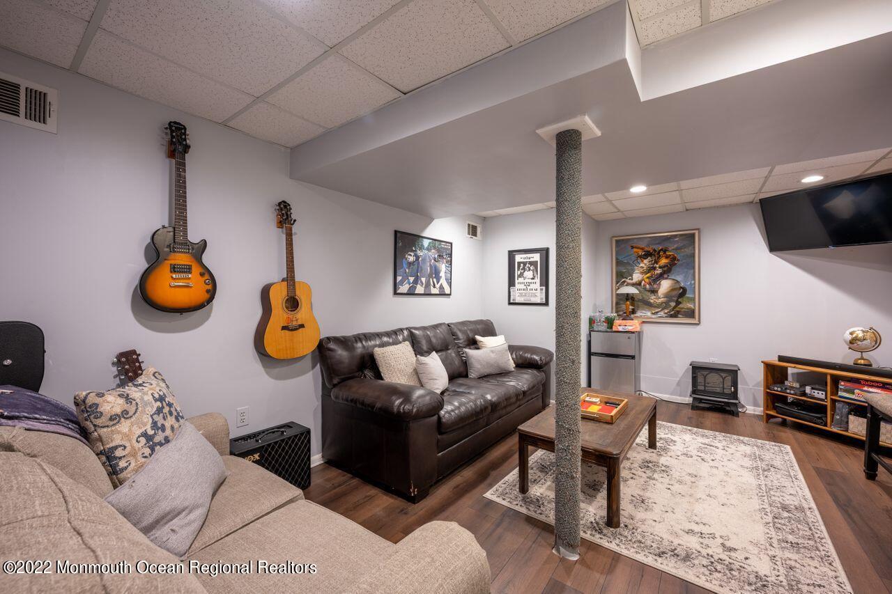 621 Reed Road Jackson, NJ 08527 - Photo 28 of 35 a living room with furniture and a wooden floor