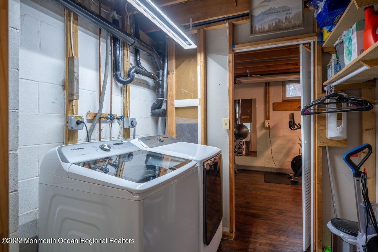 621 Reed Road Jackson, NJ 08527 - Photo 32 of 35 a kitchen with a sink and a refrigerator