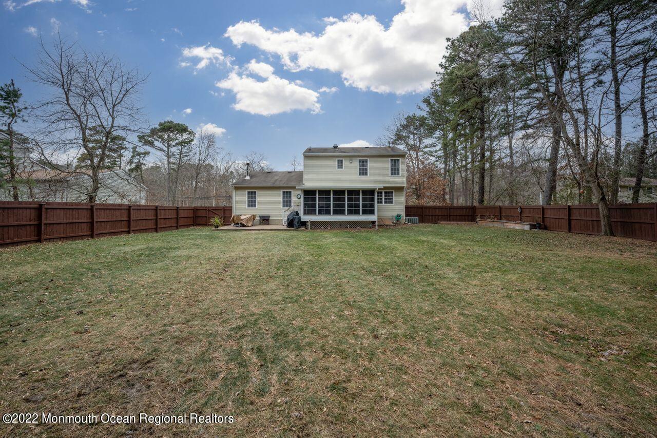 621 Reed Road Jackson, NJ 08527 - Photo 33 of 35 a view of a house with a big yard and large trees