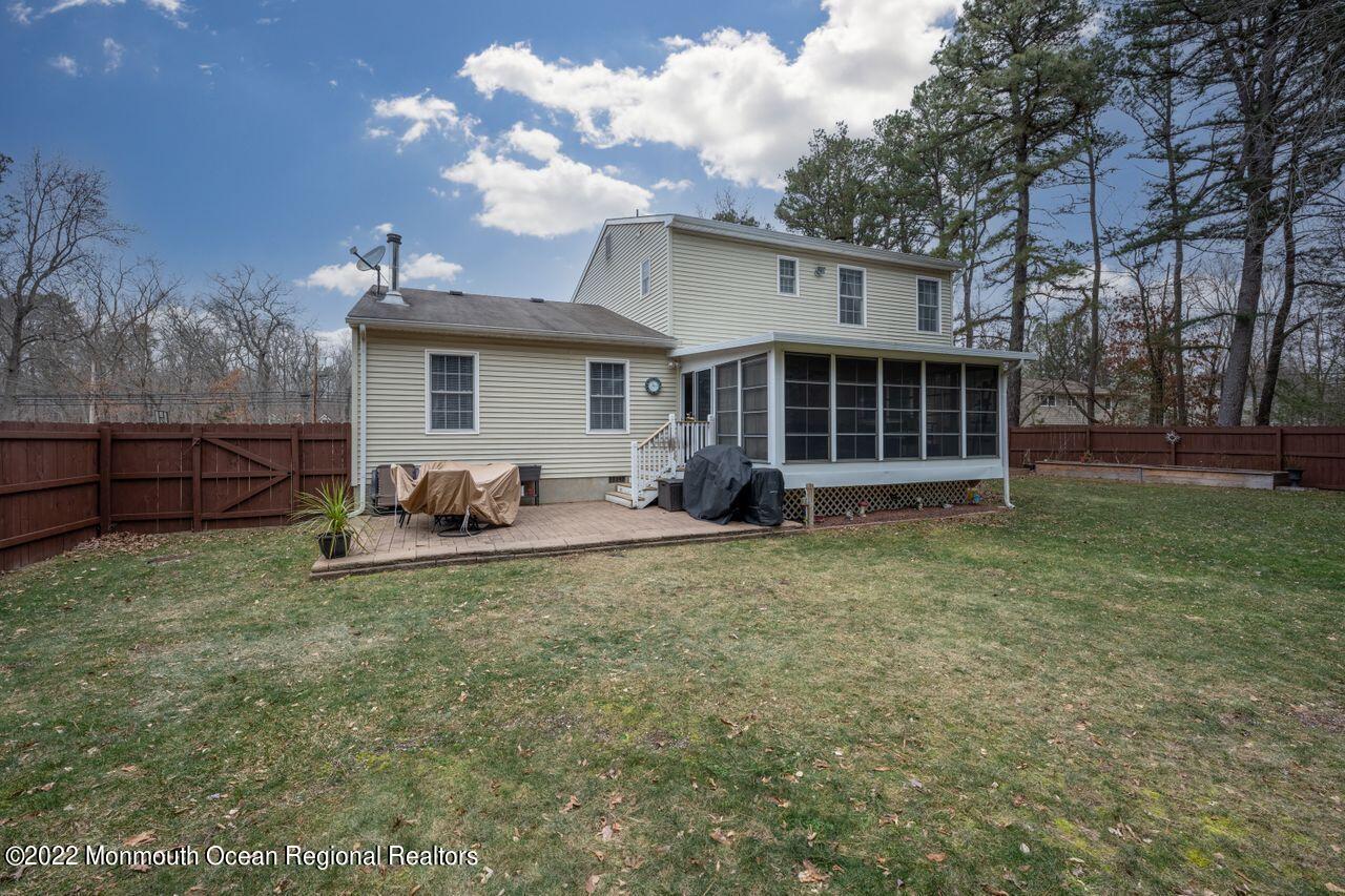 621 Reed Road Jackson, NJ 08527 - Photo 34 of 35 a backyard of a house with table and chairs