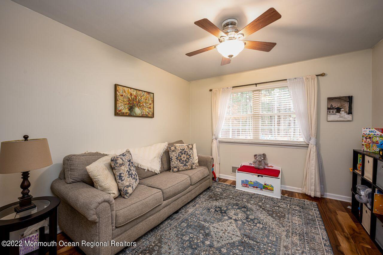 621 Reed Road Jackson, NJ 08527 - Photo 7 of 35 a living room with furniture and a window