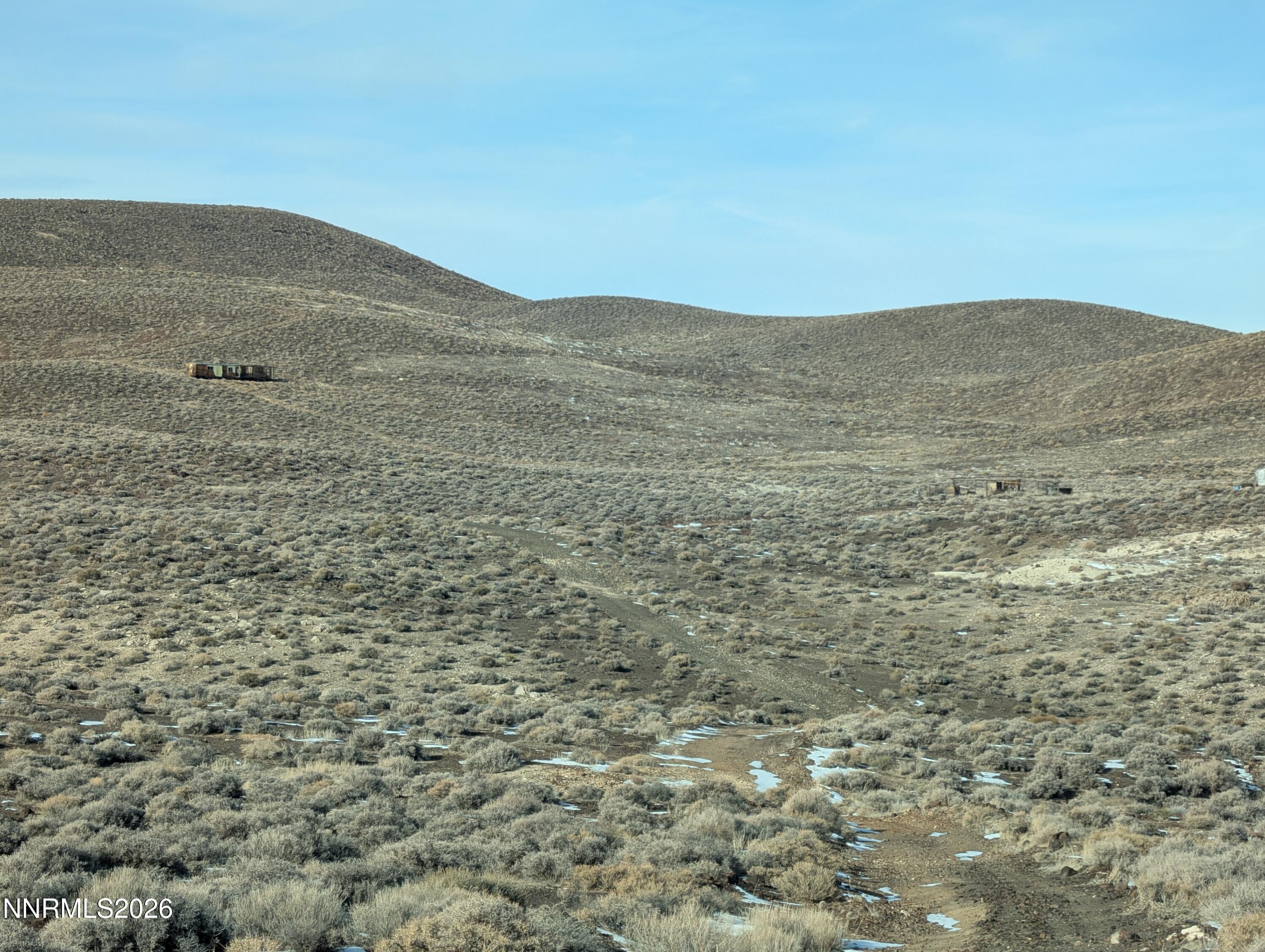0 East Gas Line Road Fernley, NV 89408 - Photo 8 of 14 a view of a large mountain with mountains in the background