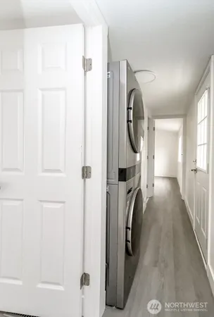 a view of hallway with washer and dryer