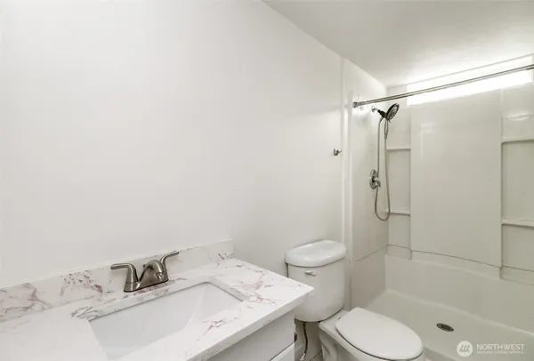 an empty room with wooden floor