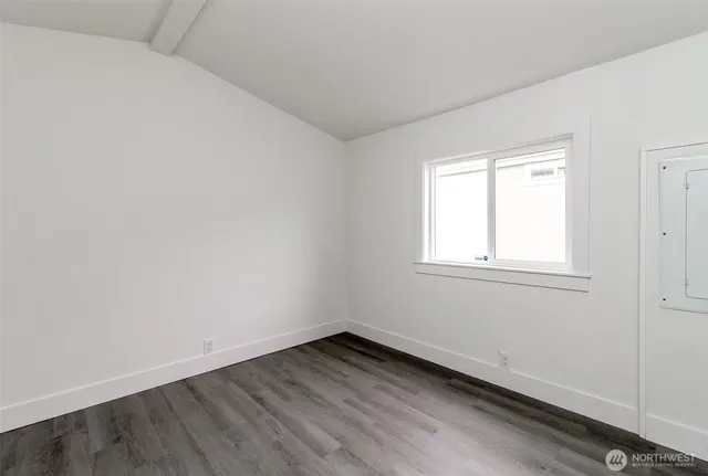 a view of a balcony with wooden floor and outdoor space