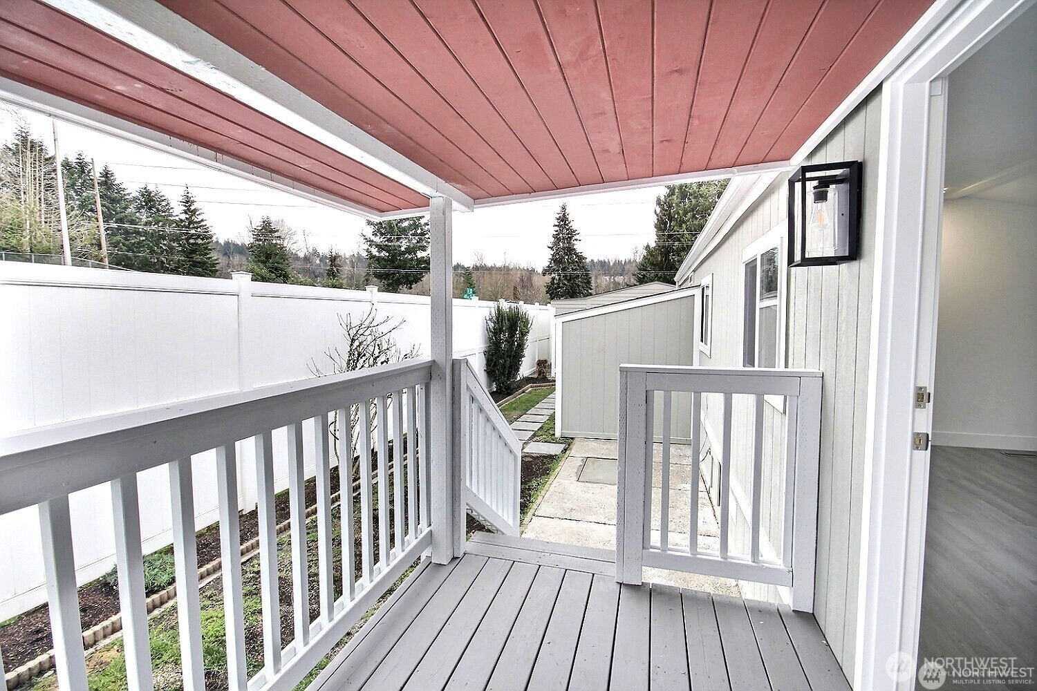 210 37th Street Southeast, Unit 35 Auburn, WA 98002 - Photo 24 of 39 a view of a balcony with wooden floor and outdoor space