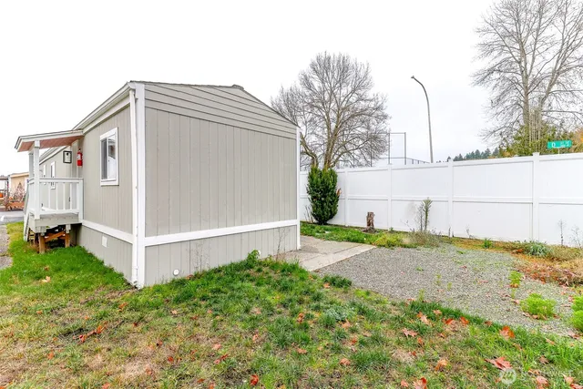a front view of building with a garden and entertaining space