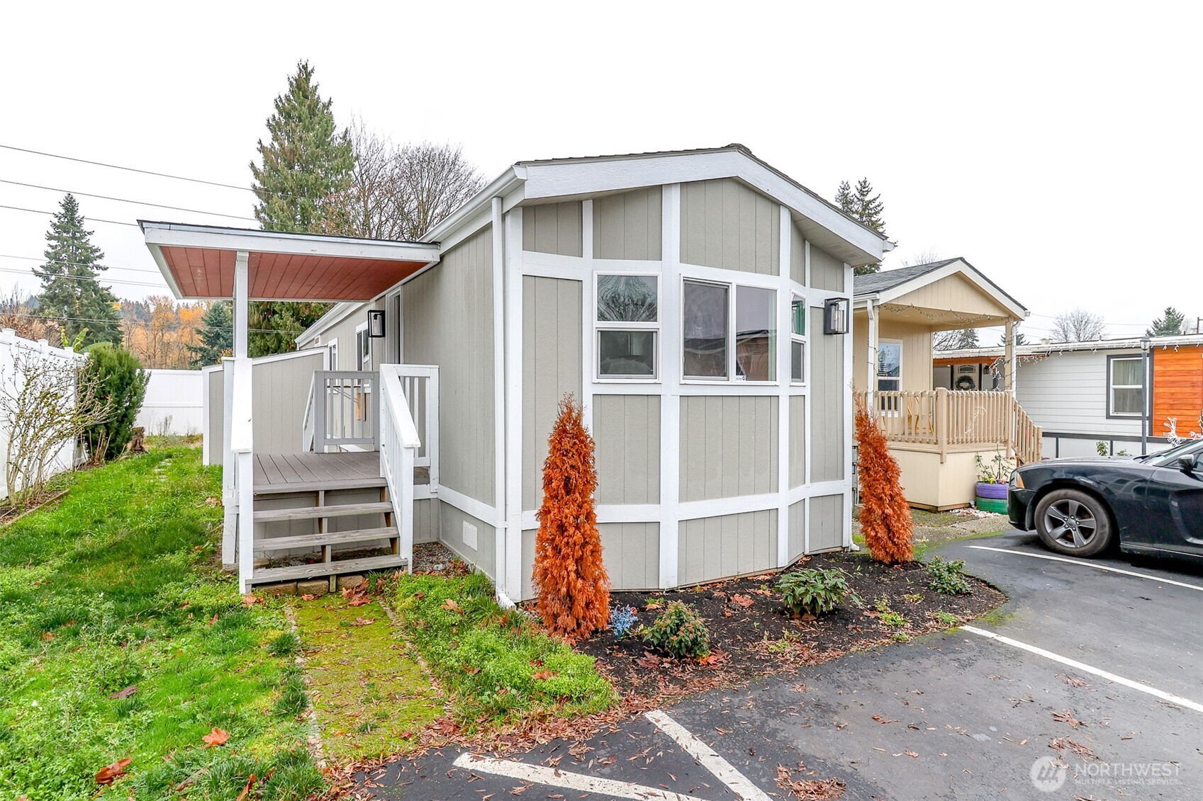 210 37th Street Southeast, Unit 35 Auburn, WA 98002 - Photo 3 of 39 a front view of a house with a yard