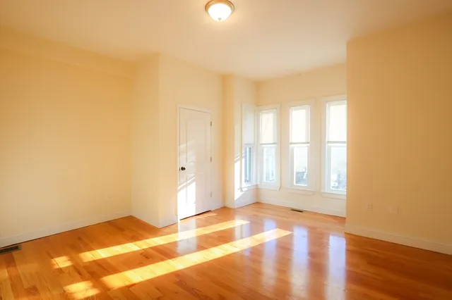 a view of an empty room and window