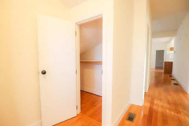 a view of a bedroom from a hallway