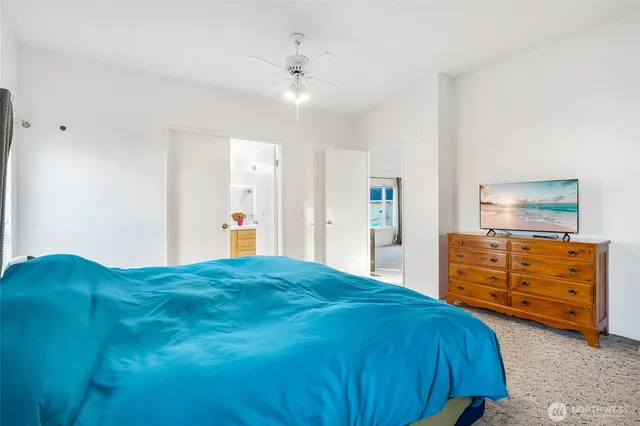 a bedroom with a bed and a dresser