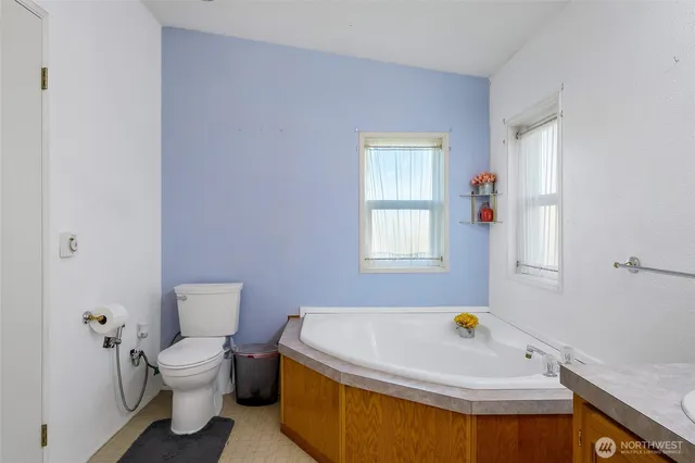 a bathroom with a sink double vanity granite and a mirror