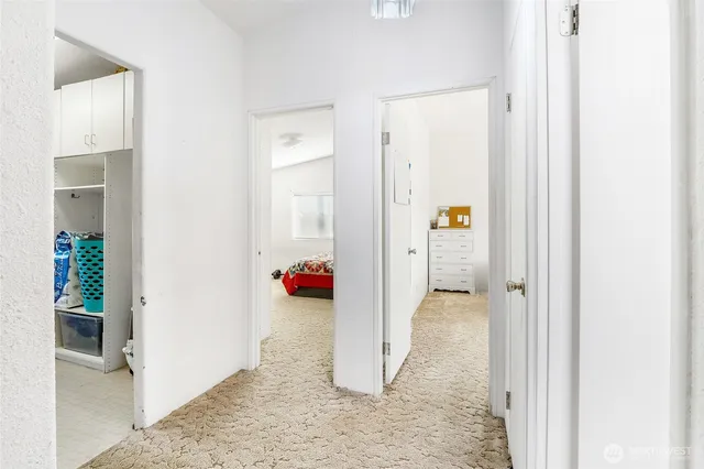 a bedroom with a bed and a closet