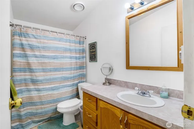 a bedroom with a bed and a cabinets