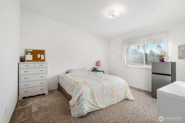 a bedroom with a bed and a cabinets