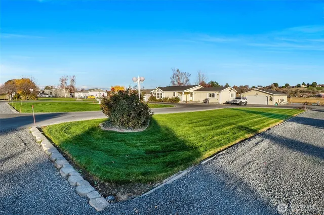 a view of a golf course with a lake view
