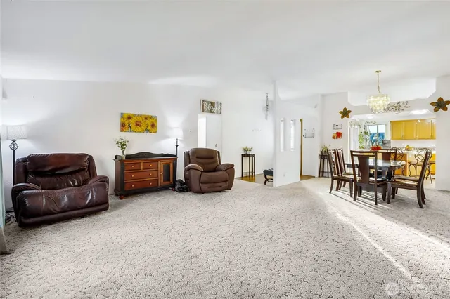 a living room with furniture and a table