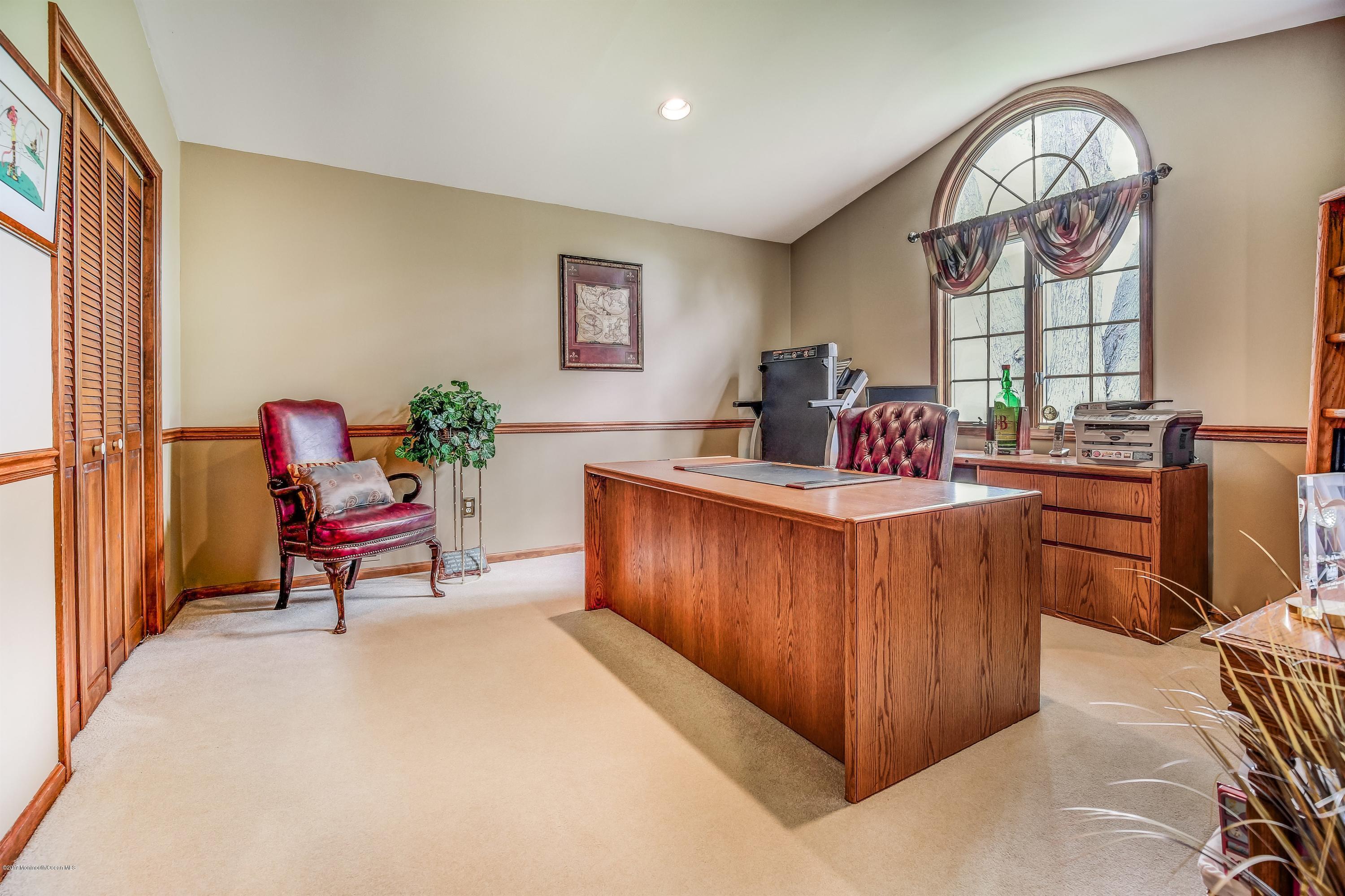 11 Applegate Road Freehold, NJ 07728 - Photo 14 of 23 a living room with furniture a window and a clock