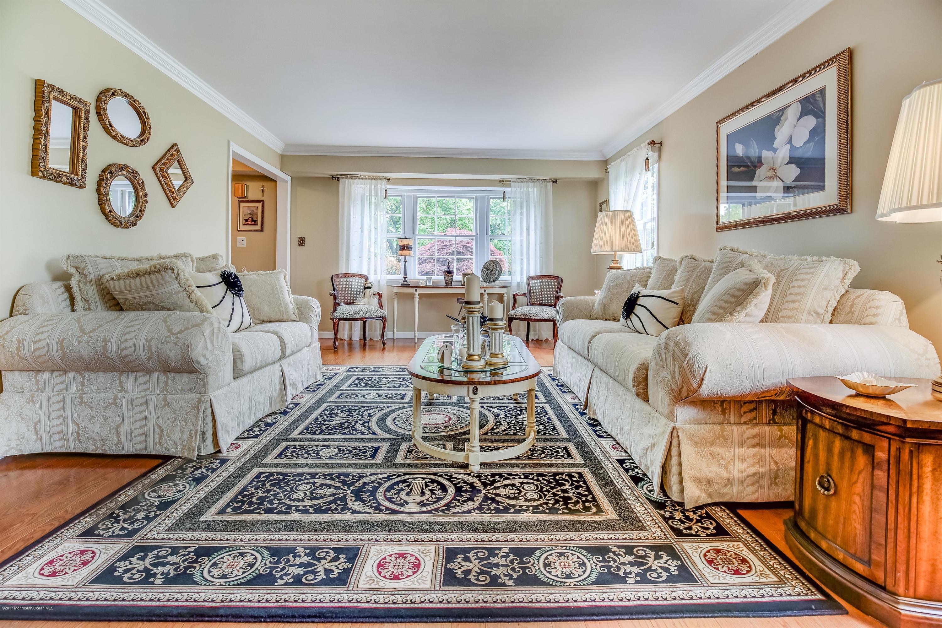 11 Applegate Road Freehold, NJ 07728 - Photo 4 of 23 a living room with furniture and a rug