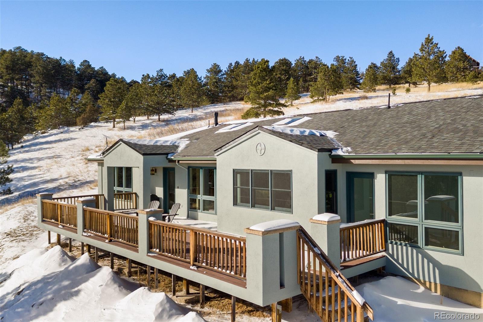 240 Dixon Road Boulder, CO 80302 - Photo 3 of 40 a view of a house with a wooden deck