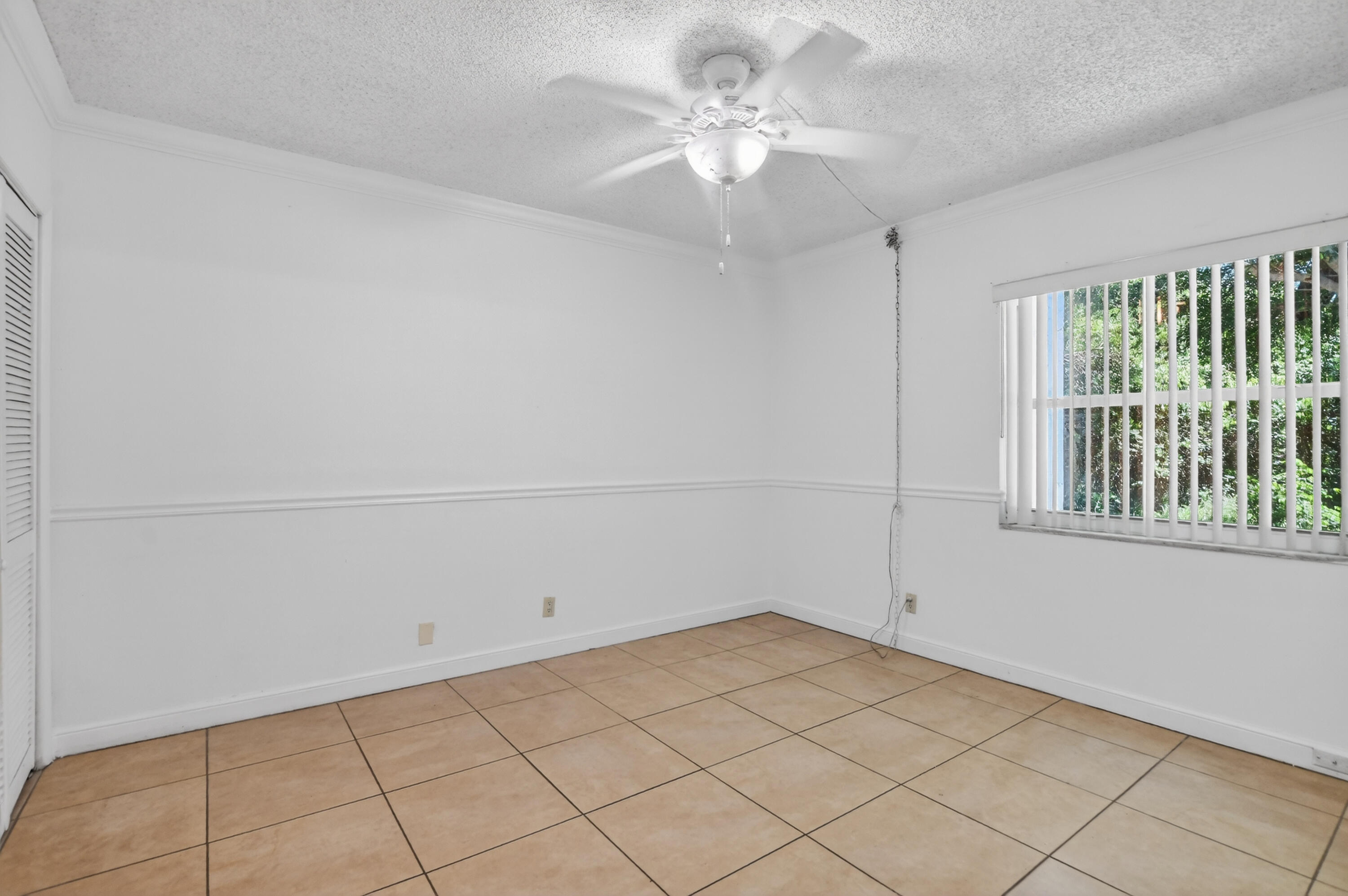 636 Northwest 13th Street, Unit 110 Boca Raton, FL 33486 - Photo 12 of 35 wooden floor in an empty room with a window