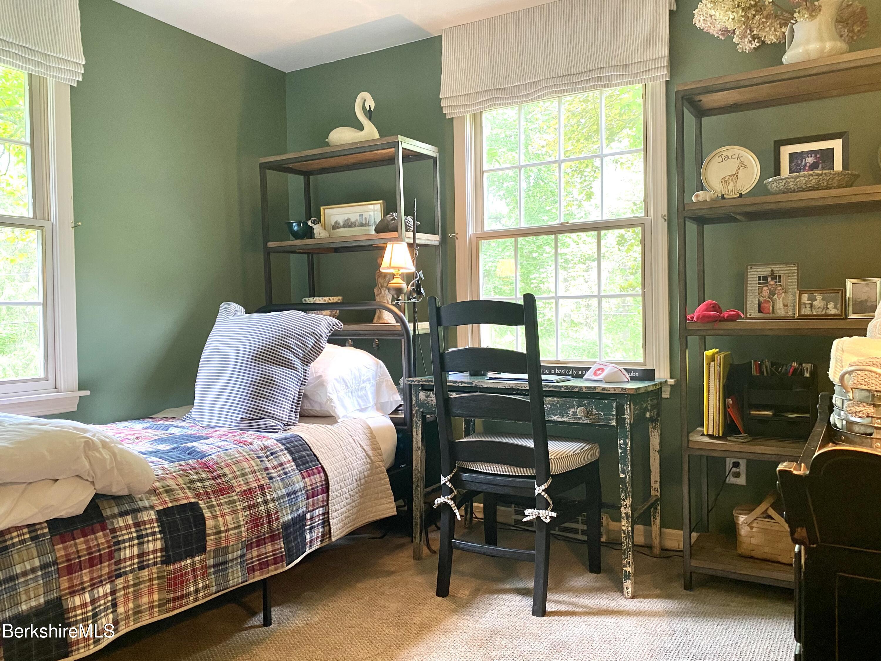 501 Holmes Road Pittsfield, MA 01201 - Photo 16 of 30 a bedroom with a bed and a table