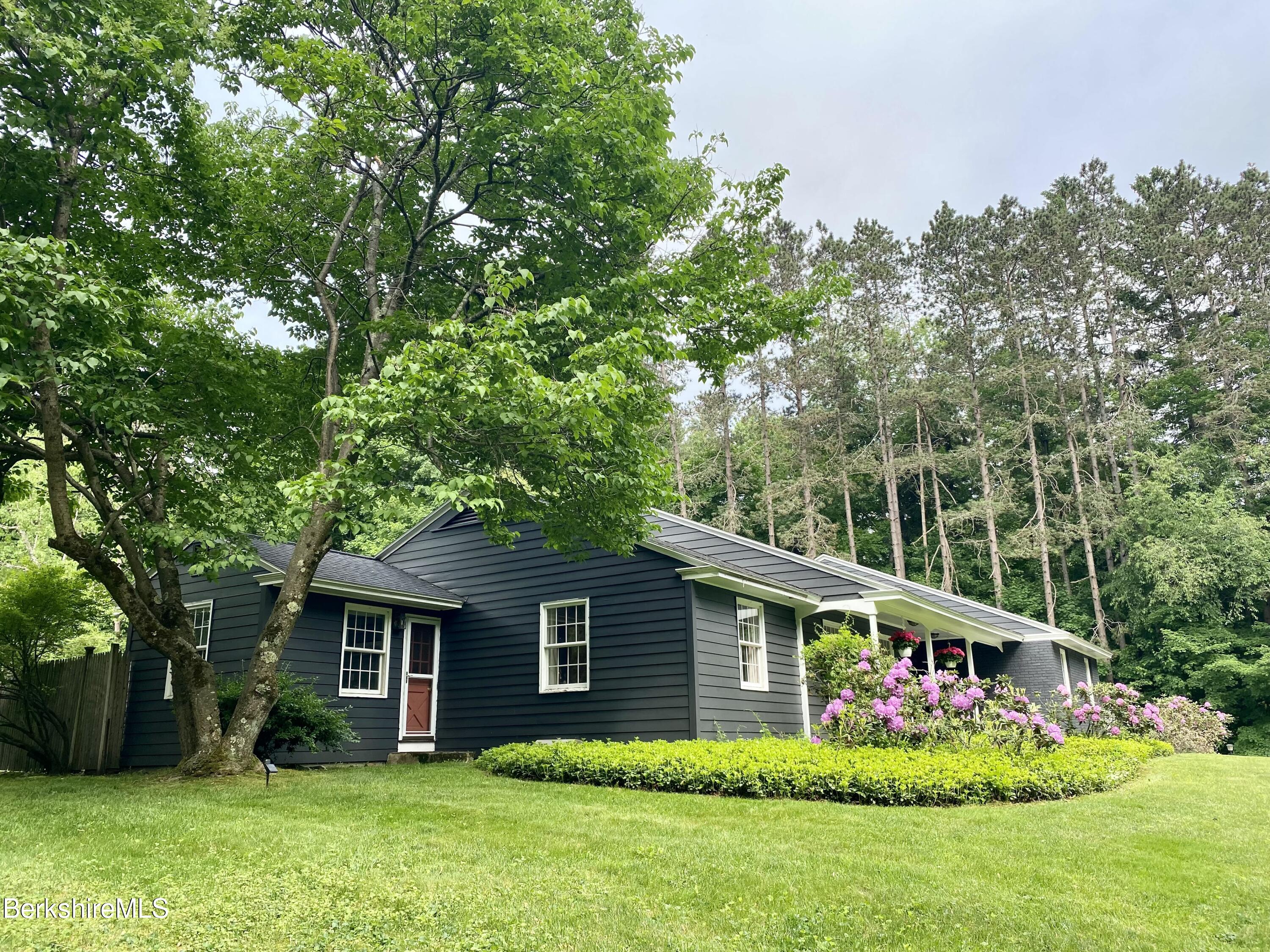 501 Holmes Road Pittsfield, MA 01201 - Photo 2 of 30 a house that has a tree in front of it