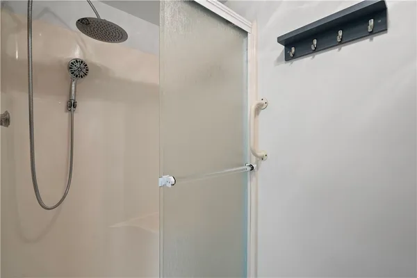 a view of washer and dryer with wooden floor