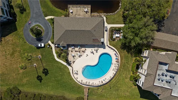 an aerial view of a house with a lake view