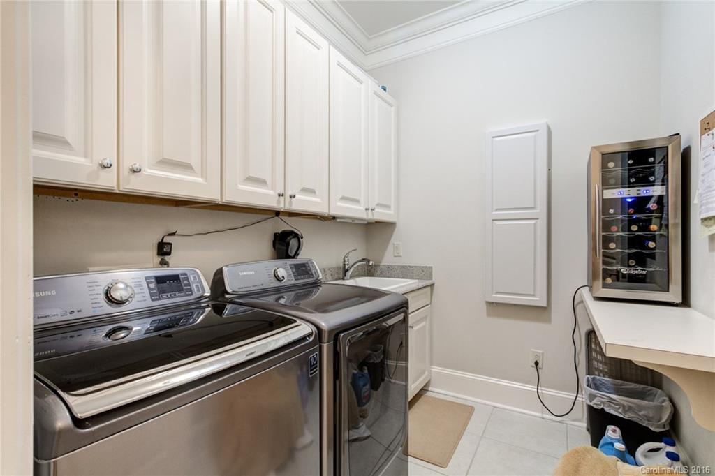 2823 Providence Road, Unit 255 Charlotte, NC 28211 - Photo 18 of 24 a kitchen with stainless steel appliances granite countertop a stove and a white cabinets