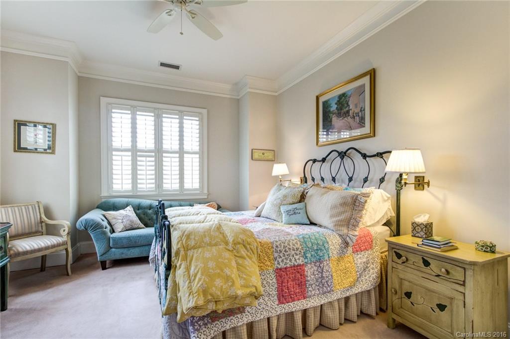 2823 Providence Road, Unit 255 Charlotte, NC 28211 - Photo 19 of 24 a bedroom with bed and a couch