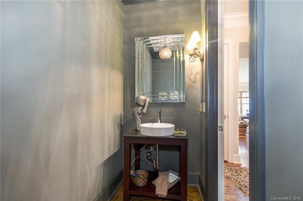 2823 Providence Road, Unit 255 Charlotte, NC 28211 - Photo 5 of 24 a bathroom with a sink and a mirror