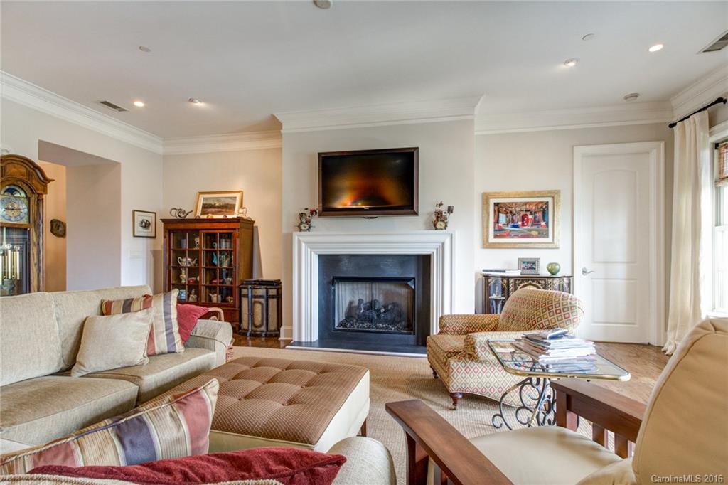 2823 Providence Road, Unit 255 Charlotte, NC 28211 - Photo 7 of 24 a living room with furniture fireplace and flat screen tv