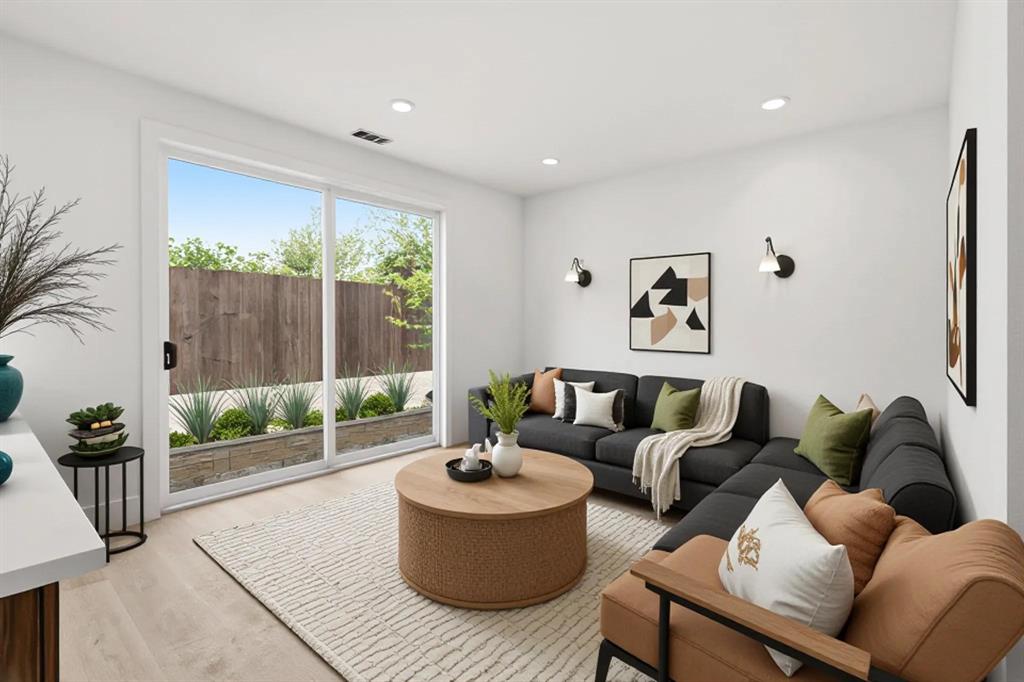 415 North Patton Avenue Dallas, TX 75203 - Photo 6 of 20 Living area featuring light-colored flooring, recessed lighting, and a sliding glass door providing natural light and views of the exterior
