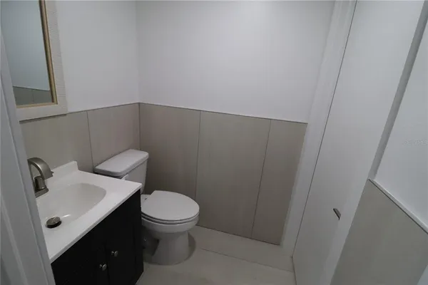 a room with a sink and cabinets