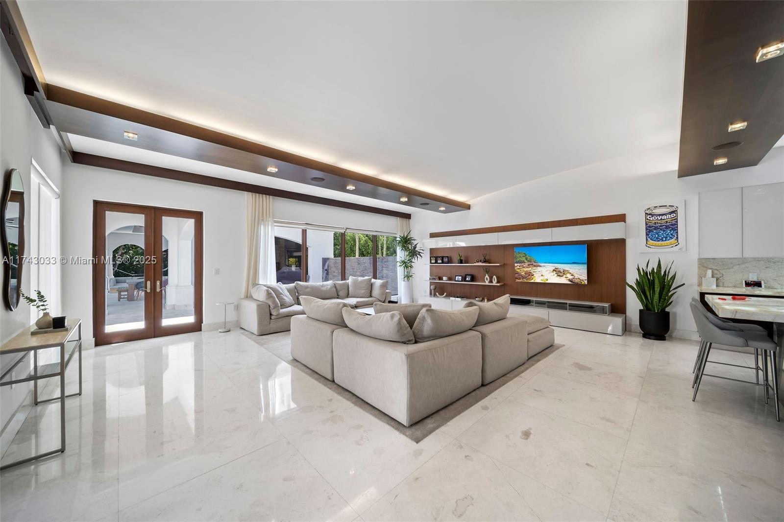 8955 Southwest 63rd Court Pinecrest, FL 33156 - Photo 13 of 59 a living room with furniture and a flat screen tv