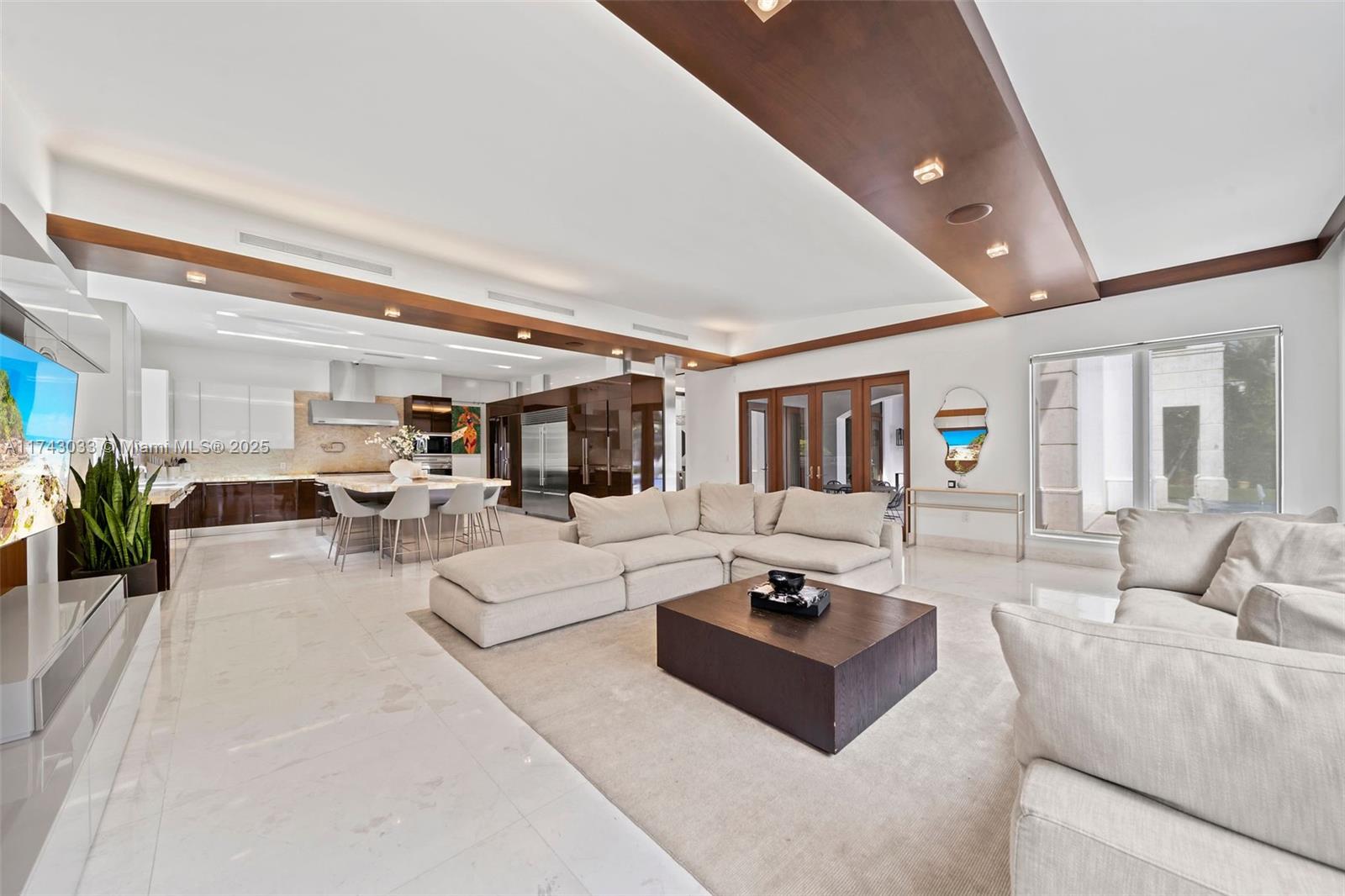 8955 Southwest 63rd Court Pinecrest, FL 33156 - Photo 14 of 59 a living room with furniture and view of kitchen