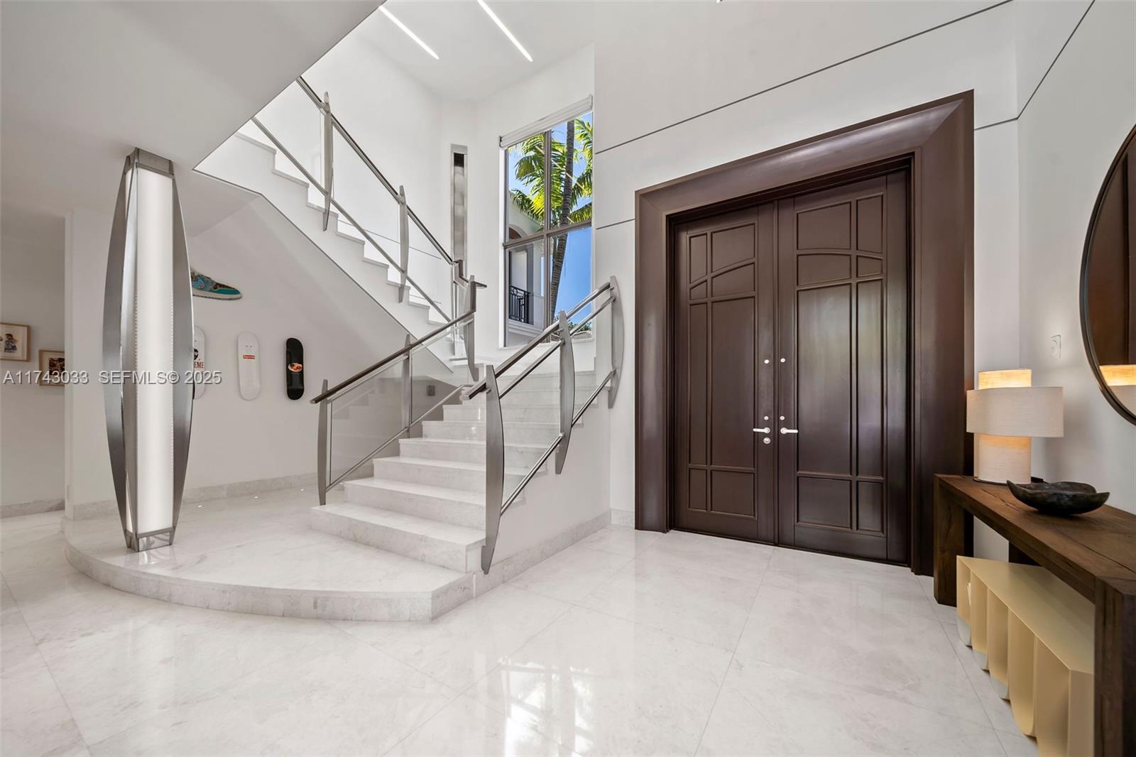 8955 Southwest 63rd Court Pinecrest, FL 33156 - Photo 17 of 59 a view of entryway and hall with a front door