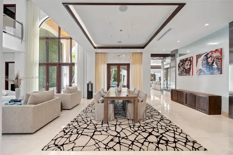 a spacious bedroom with a large bed and furniture