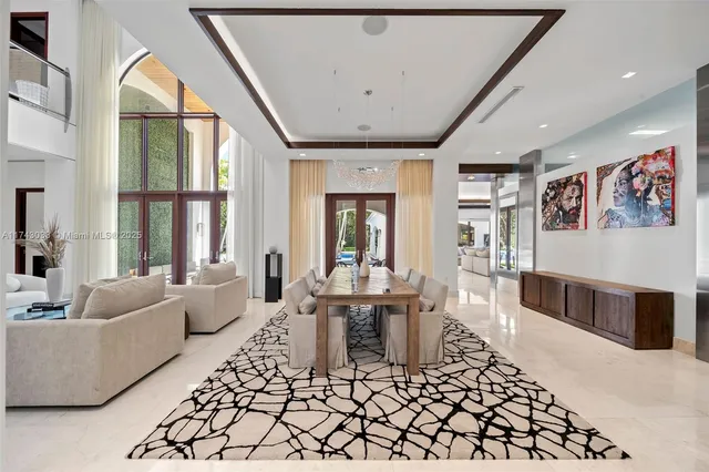 a spacious bedroom with a large bed and furniture