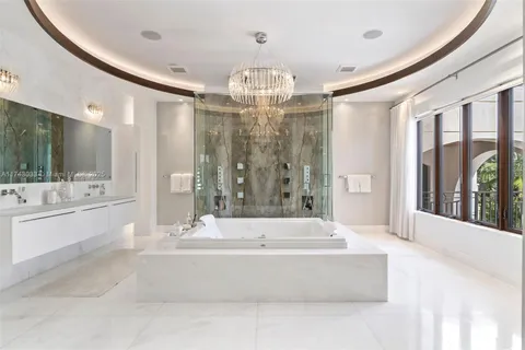 a hallway with cabinets and window