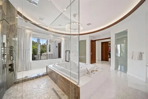 a view of walk in closet with clothes