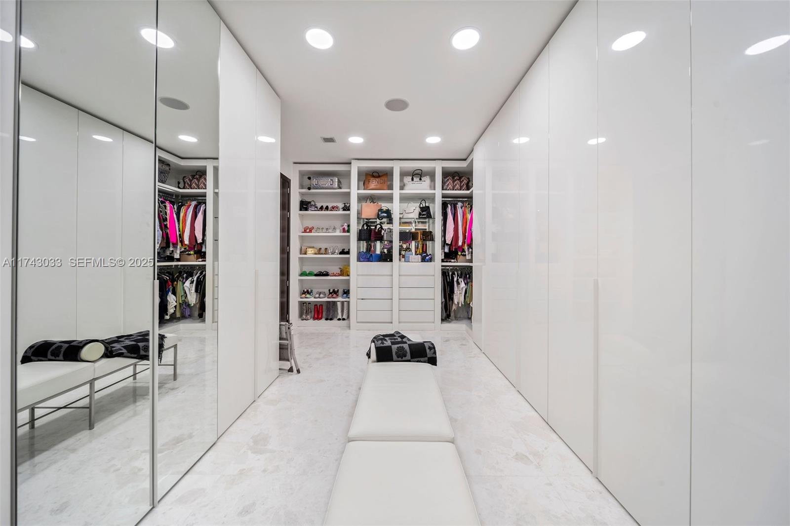 8955 Southwest 63rd Court Pinecrest, FL 33156 - Photo 26 of 59 a hallway with cabinets and window