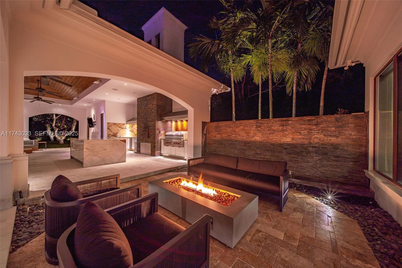 8955 Southwest 63rd Court Pinecrest, FL 33156 - Photo 27 of 59 a building outdoor space with patio furniture