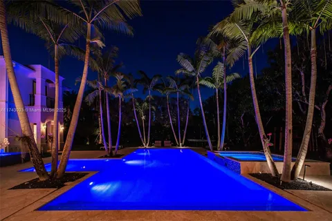 a kitchen with microwave a stove and furniture