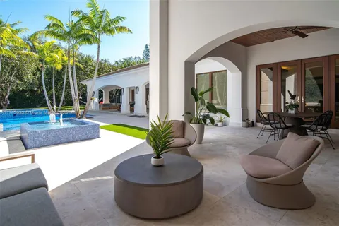 a living room with furniture and a rug