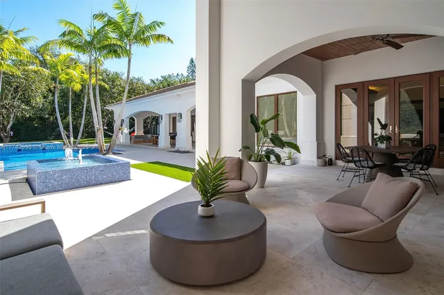 a living room with furniture and a rug