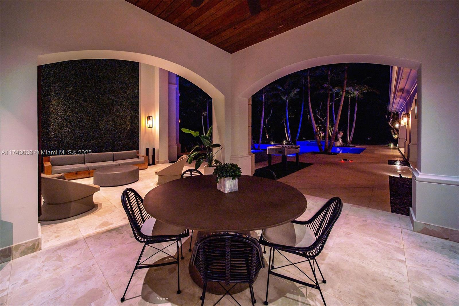 8955 Southwest 63rd Court Pinecrest, FL 33156 - Photo 35 of 59 a view of a dining room with furniture and chandelier