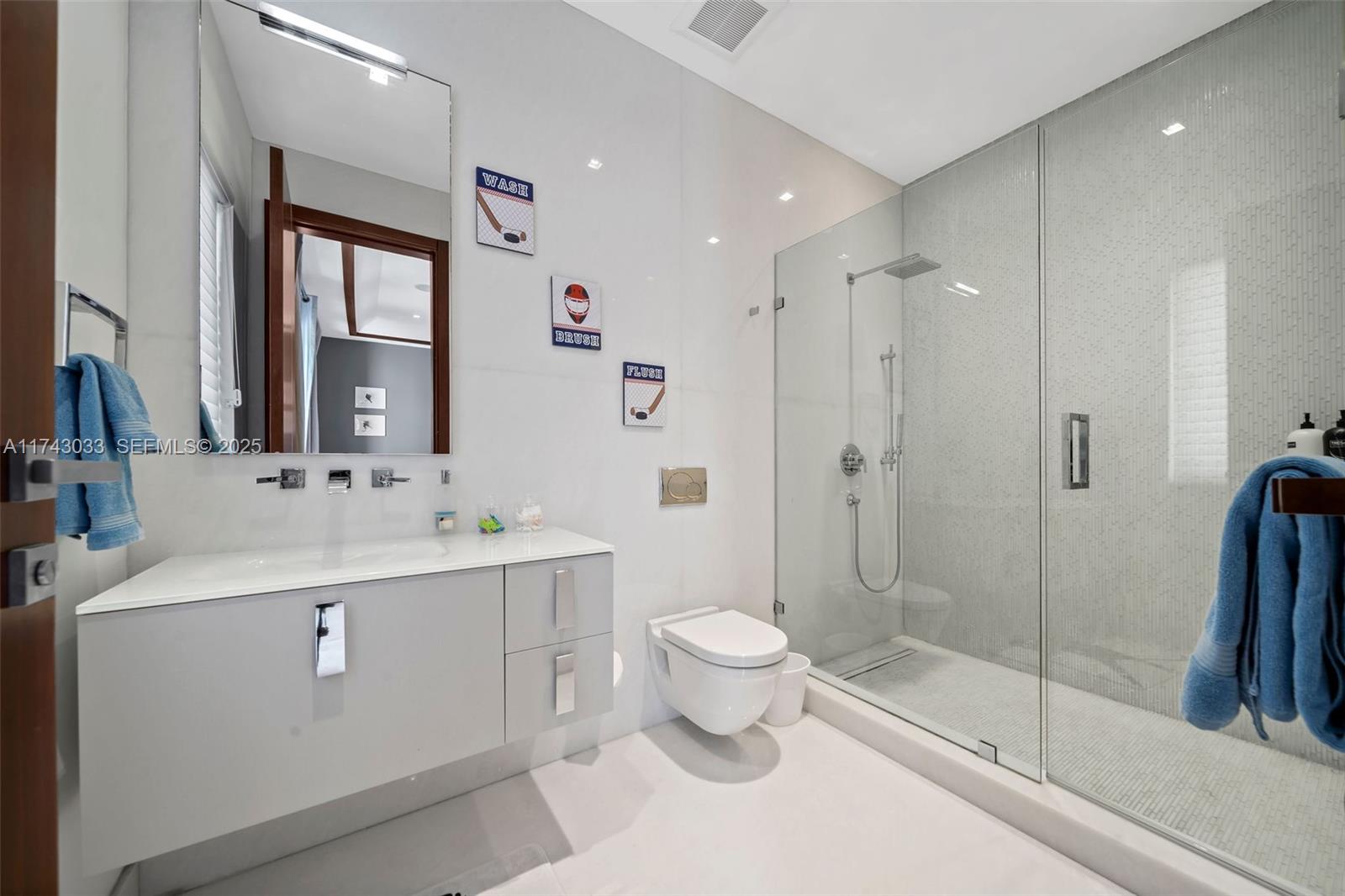 8955 Southwest 63rd Court Pinecrest, FL 33156 - Photo 38 of 59 a bathroom with a sink toilet and shower