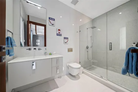 a kitchen with granite countertop cabinets stainless steel appliances a sink and a large window